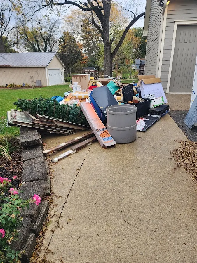 Dumpster being loaded with debris for 10 Yard Dumpster Rental in North Catasauqua